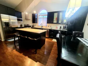 Image of Relax in the Hot Tub, Sleep in Comfort on a King Bed, Play Pool, Charge Your EV