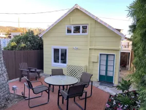 Image of Yellow Beach House 500' to the Waves- Electric Car Charger!