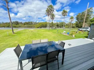 Image of Lakeside House Tuncurry with deck overlooking the lake