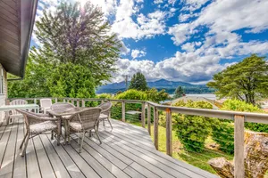 Image of Magnificent Dog-Friendly Home w\/ Lake & Mountain Views from the Large Deck
