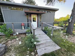 Image of The Adventure Center rustic tiny cabin hot tub access stage stars sunsets & pets