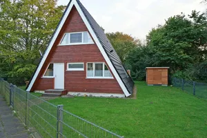 Image of Tent roof house with fence and beautiful grounds - - with electric awning