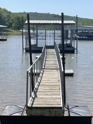 Image of Lake front retreat, covered boat dock, large deck , fenced play area, RV parking