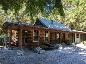 Image of Cozy Log Cabin in peaceful wooded surroundings