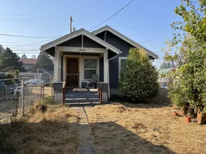Image of Cozy pet friendly cottage nestled a quiet backyard.