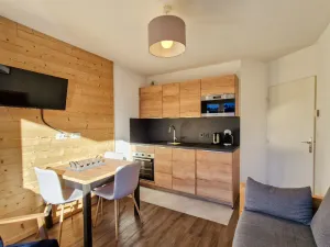 Image of Bright Apartment with Covered Parking · Center of Resort · Balcony