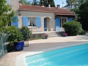 Image of House with saltwater pool in a green setting