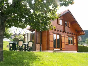 Image of Magnificent Chalet seen from the lake near the quiet ski slopes 4 people
