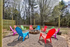 Image of Wooded Cottage w\/ Game Room\/Fire pit\/1mi to Beach