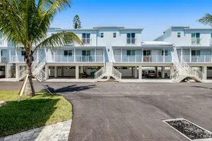 Image of Inviting oceanfront condo with pool, dock, balcony, & W\/D