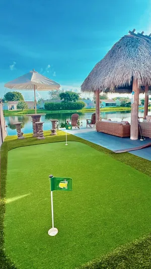 Image of 3 BDRM LAKE HOUSE OF BOCA RATON HEATED POOL TIKI HUT AND GOLFING PUTTING GREEN