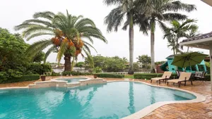 Image of Waterfront Property with a resort style backyard and Heated Pool in Miami