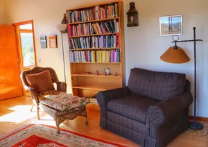 Image of One Cozy BR and a separate Large BR that opens onto a Deck with Mountain views