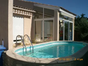 Image of House with pool in residential area
