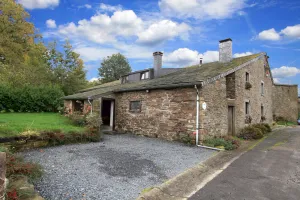 Image of Farmhouse situated at the edge of the woods