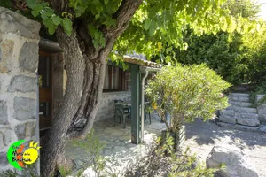 Image of Stone cottage, swimming pools, playground, enclosed gite village with trees