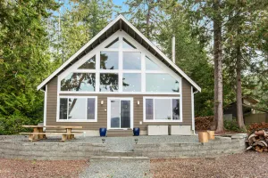 Image of Stunning ocean-view home with private waterfront, viewpoint deck & fireplace