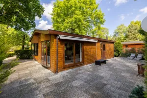 Image of These wooden chalets are spacious and offer great convenience and comfort, and have a surface area of about 75 m². They are suitable for 4 people, are detached, and nicely decorated. In the living room you will find the seating- and dining area.