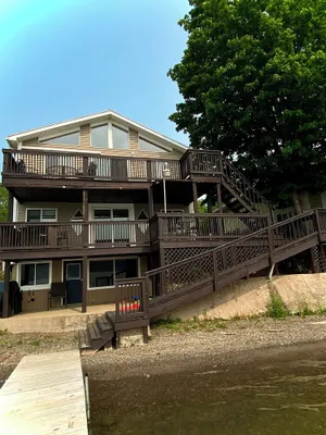 Image of 4 season escape boasts 5 beds and now a HOT TUB to enjoy any time of year!