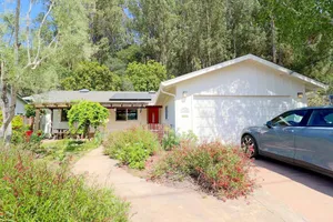 Image of Just one mile from the beach, you'll find our charming and modern 3BR, 2BA house...