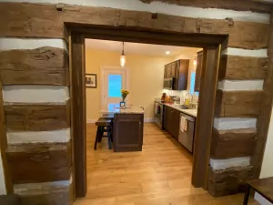 Image of Small town atmosphere near local and large city attractions.  Original Log wall.
