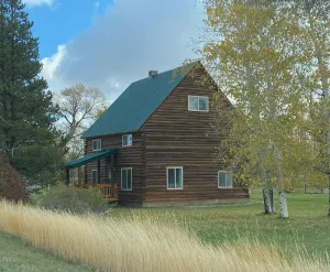 Image of Cozy, inviting log cabin near U.S. 20 on the way to Island Park and Yellowstone