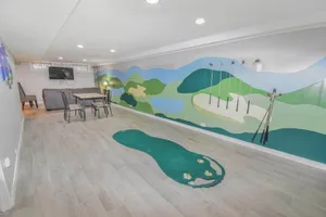 Image of Family Home with Large Yard & Golf Theme Near Rail
