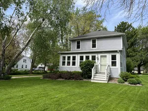 Image of EAA rental near airport w\/firepit, backyard, peekaboo lake view, and a clear sky