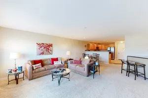 Image of Open & airy condo w\/ private balcony, jetty view, & quick access to the beach