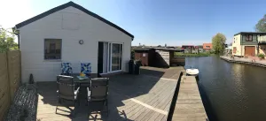 Image of Modern, bright vacation home with lots of sun and its own jetty