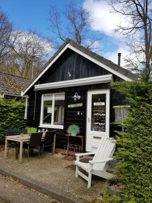 Image of Cozy wooden cottage in prime location, right on the dunes in the center of Schoorl!