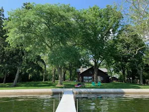 Image of Stunning lakefront log cabin on a private acre