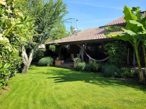 Image of Peaceful wooden house in a green setting 10 minutes from the beach!