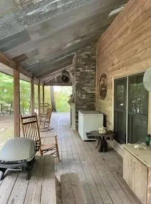 Image of Cabin in the woods overlooking Grenada lake.