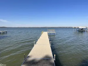 Image of Enjoy this beach front lake home that boasts 66' of frontage with many amenities
