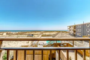 Image of Stylish coastal gem with balcony, pool & beach access