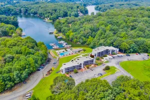 Image of Waterfront condo with lake-view deck, tennis court & pool - dog-friendly