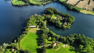 Image of Idyllic vacation accommodation by the lake with a view of the horse pasture -Gut Wittmoldt-