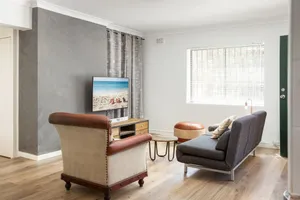 Image of Suburban Two-bed Apartment with Parking and Patio