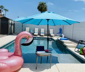 Image of Resort Style Backyard- Heated Pool, Putting Green, Outdoor TV and Pool Table.