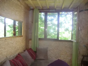 Image of Cabin perched in the trees with jacuzzi and swimming pool
