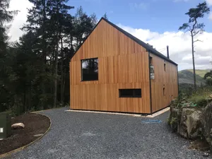Image of An Caisteal chalet sleeps up to 8 guests  in 4 bedrooms with loch, mountain and waterfall view.