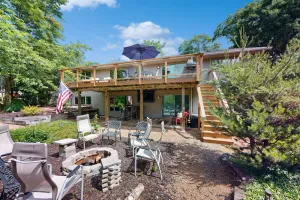 Image of Green side smart home with golf, beach\/lake access, off-site dock & EV charger