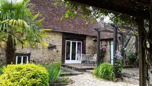 Image of Typical stone house with swimming pool surrounded by nature