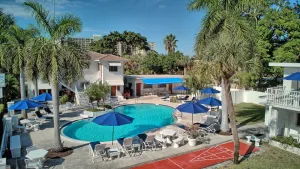 Image of Upstairs unit w Pool view, enclosed porch & workspace