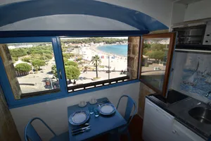 Image of Studio on the Beach, feet in the water