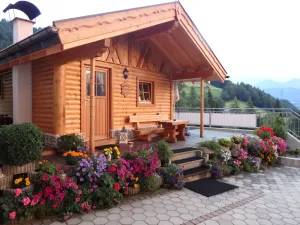 Image of Beautiful wooden hut with a cozy fireplace, stone pine parlor and stone pine bed