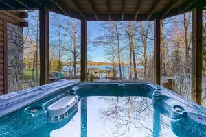 Image of Inviting waterfront cabin with hot tub, kayaks, and beautiful sunsets
