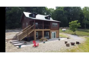 Image of Log Cabin on a private 18 acre lake, with a hot tub, kayaks and fishing.