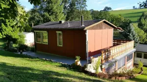 Image of Cozy vacation home surrounded by greenery
